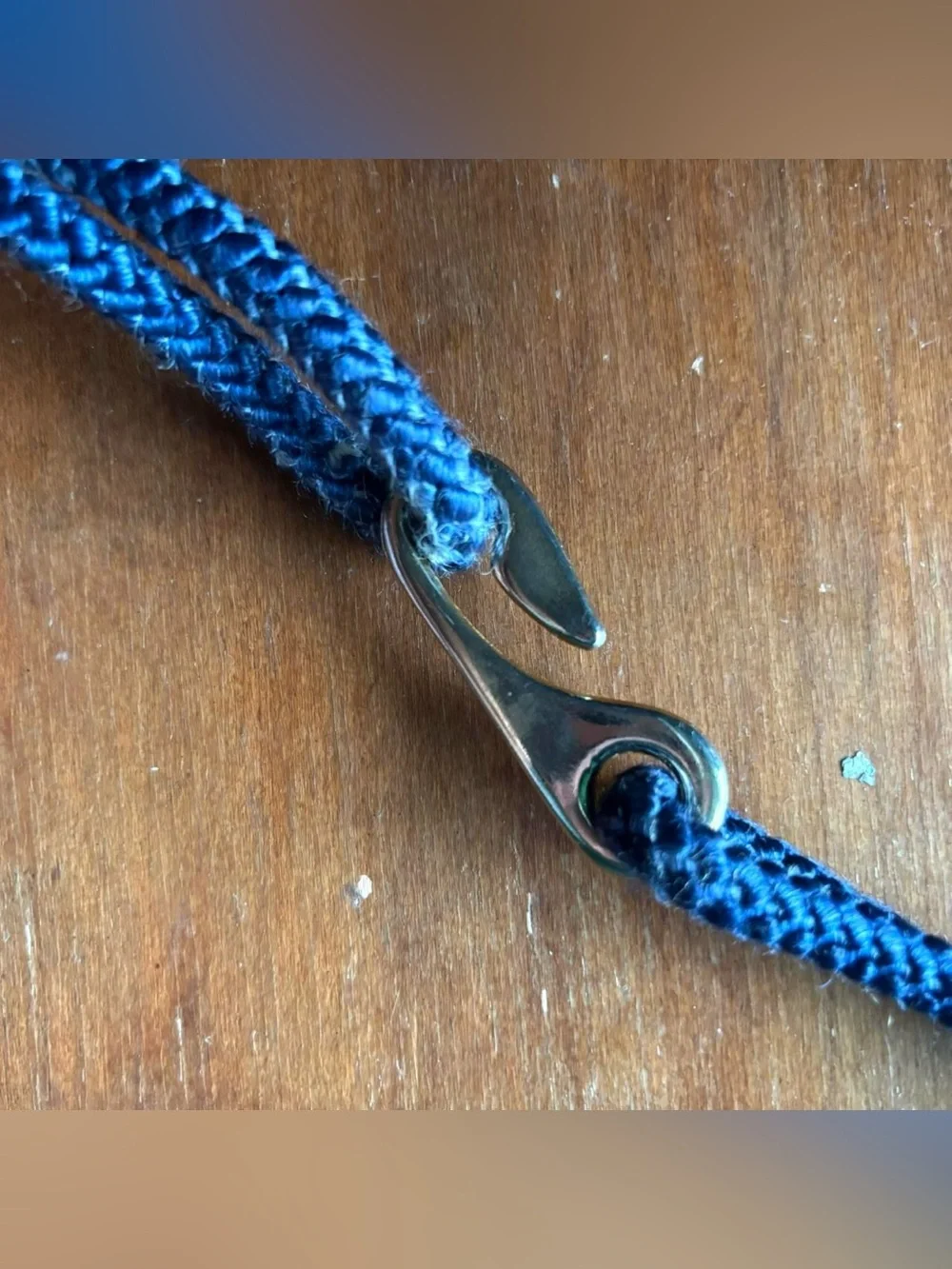 Multicoloured braided belt with decorative medallion